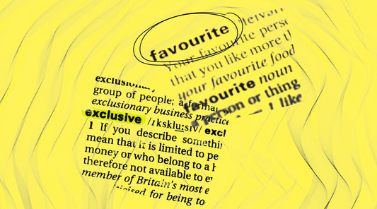 dictionary definitions of favourite and exclusive on a yellow textured background