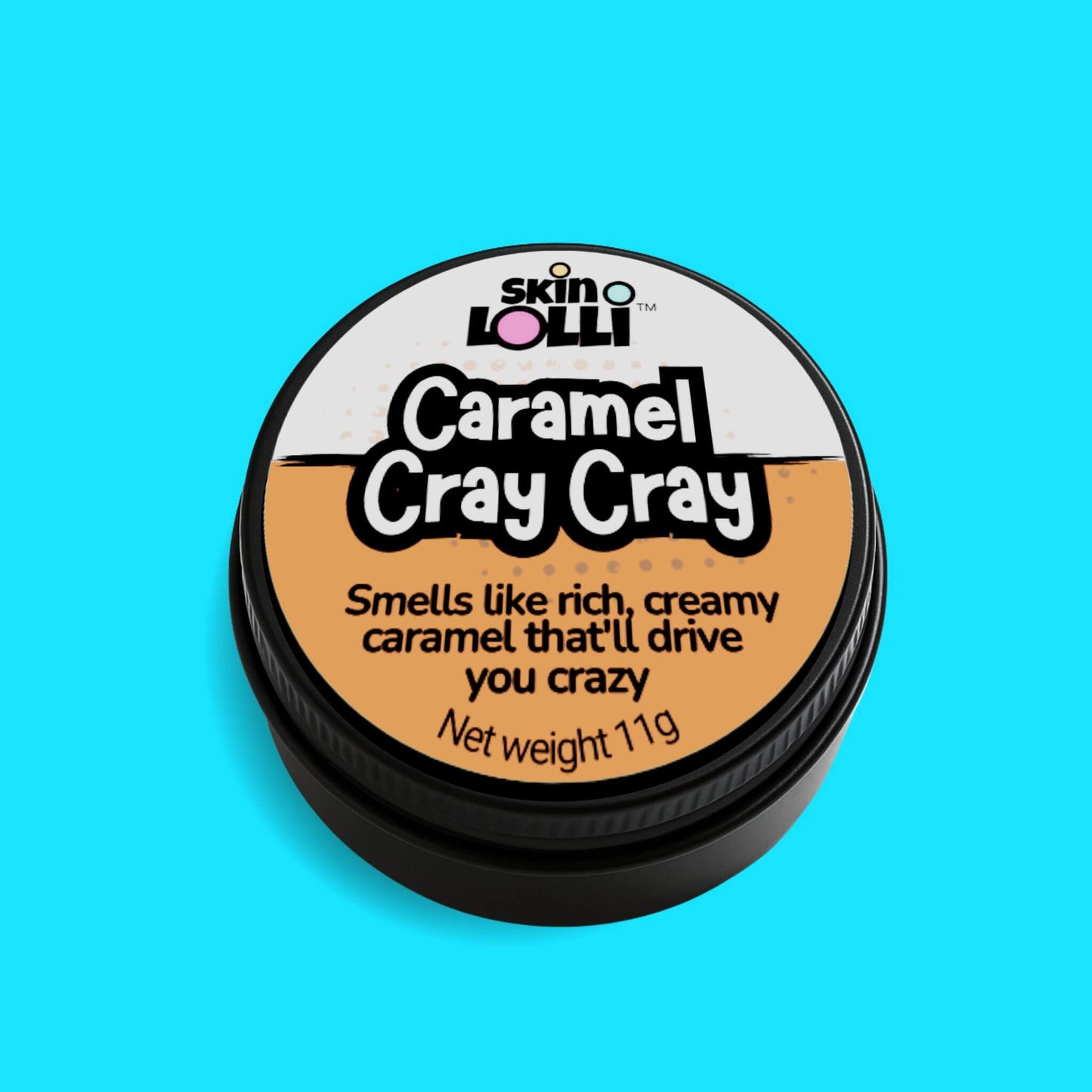 tin of Caramel Cray Cray by Skin lolli, a caramel scented solid perfume, against a pink background