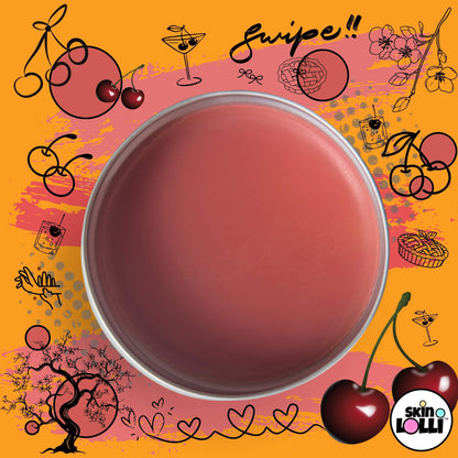 open Tin of 'Pop My Cherry' swipe-on scent by Skin Lolli surrounded by cherry doodles