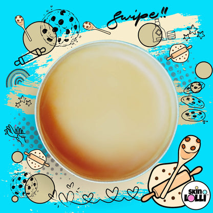 Open tin of Tin of Skin Lolli 'Battered & Boozed' cookie dough swipe-on scent surrounded by cookie doodles 