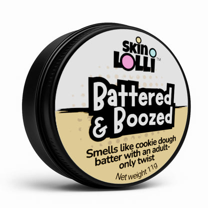 Tin of Skin Lolli 'Battered & Boozed' cookie dough swipe on scent on a white background