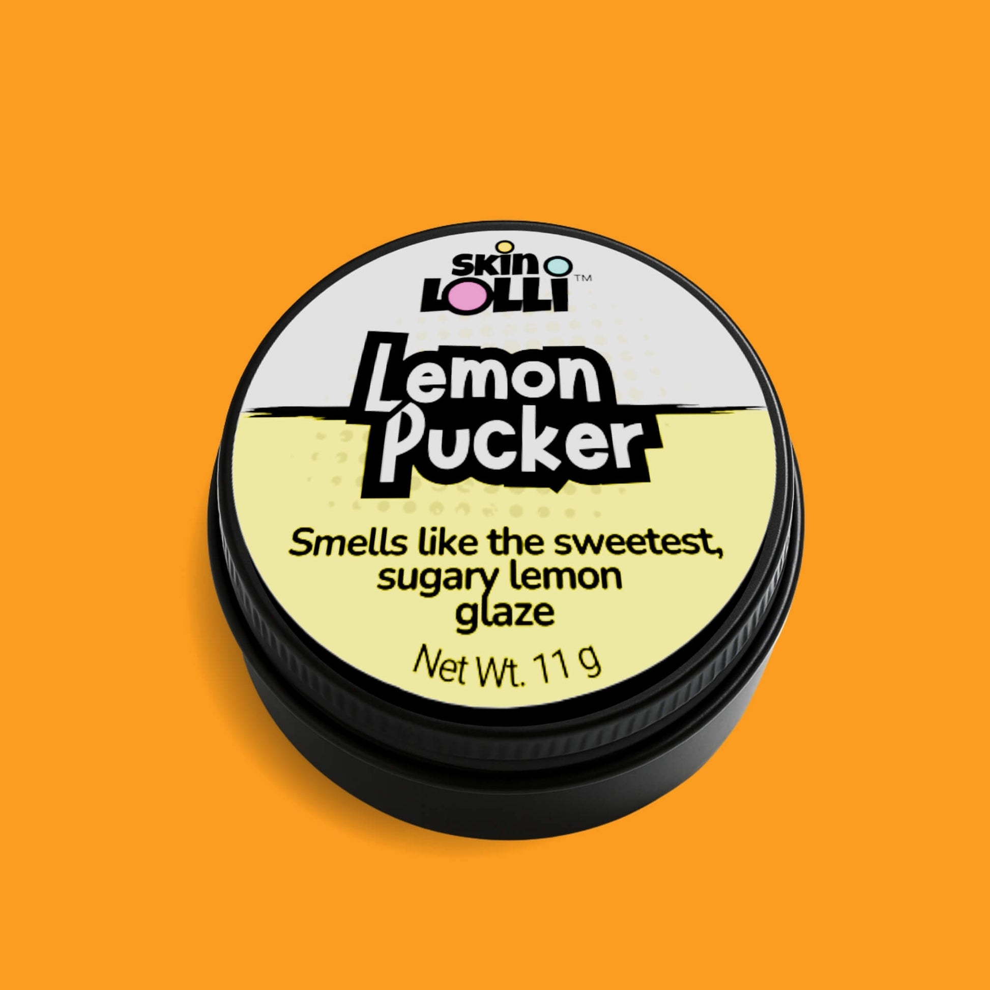 Tin of Skin LOLLI Lemon Pucker swipe on perfume against orange background