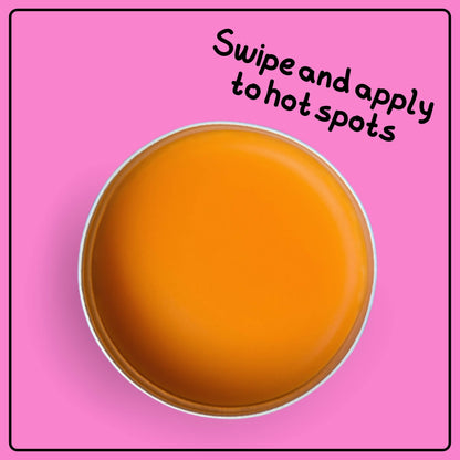 open tin of mango pirate by skin lolli, a mango scented swipe on perfume, on a pink background. text reads swipe and apply to hot spots.