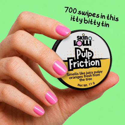 Hand holding tin of Pulp Friction by SKIN LOLLI, an orange perfume that swipes on skin. Message on top of picture says, 700 swipes in this itty bitty tin