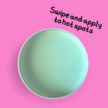open tin of Skin Lolli Tutti Frutti Tingle swipe on scent on a pink background. text reads, swipe and apply to hot spots