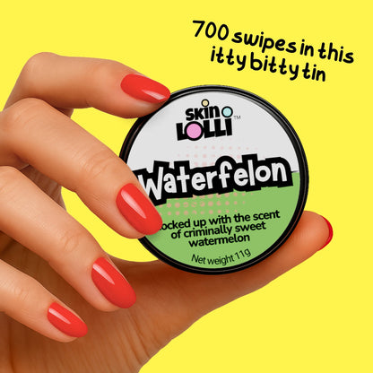 Hand holding tin of Skin Lolli Waterfelon - watermelon swipe-on scent, text reads 700 swipes in this itty bitty tin
